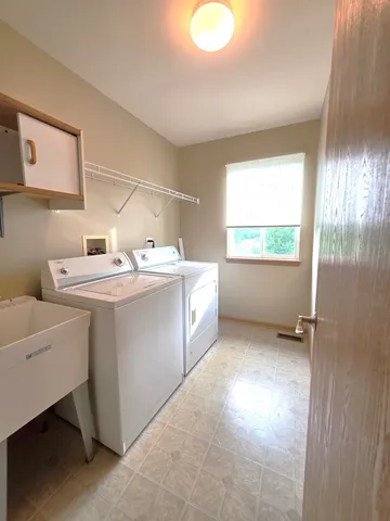 a utility room with dryer and washer