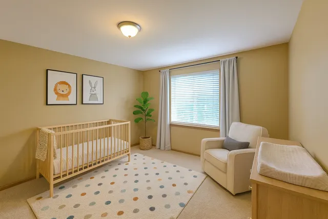 a bedroom with furniture and a window