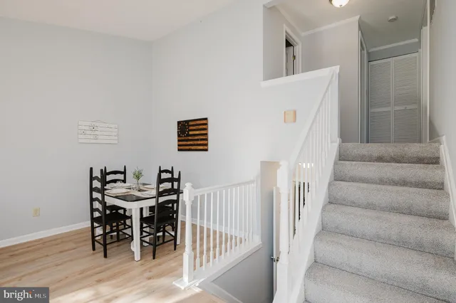 a view of a livingroom with furniture and stairs