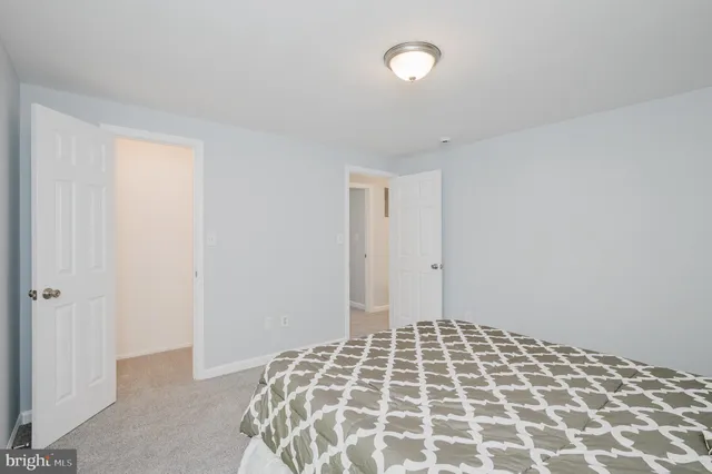 a bedroom with a bed and a cabinets