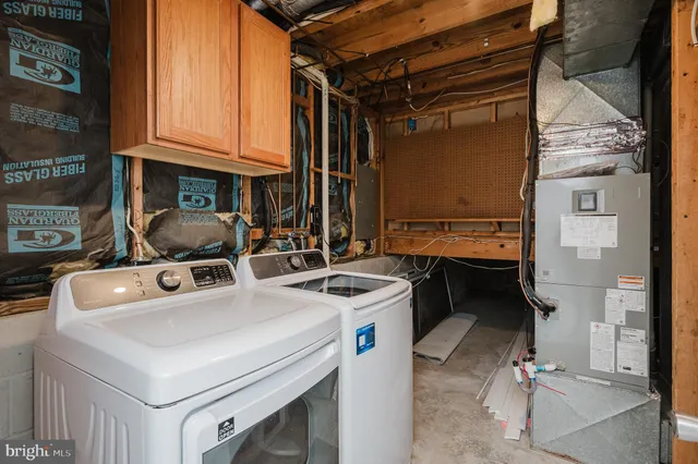a view of a patio with table and chairs with wooden floor and fence