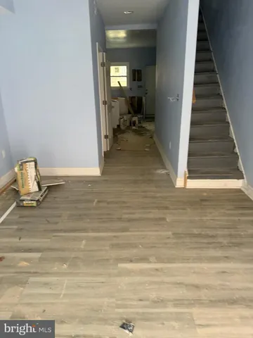 a bathroom with a sink a window and glass door