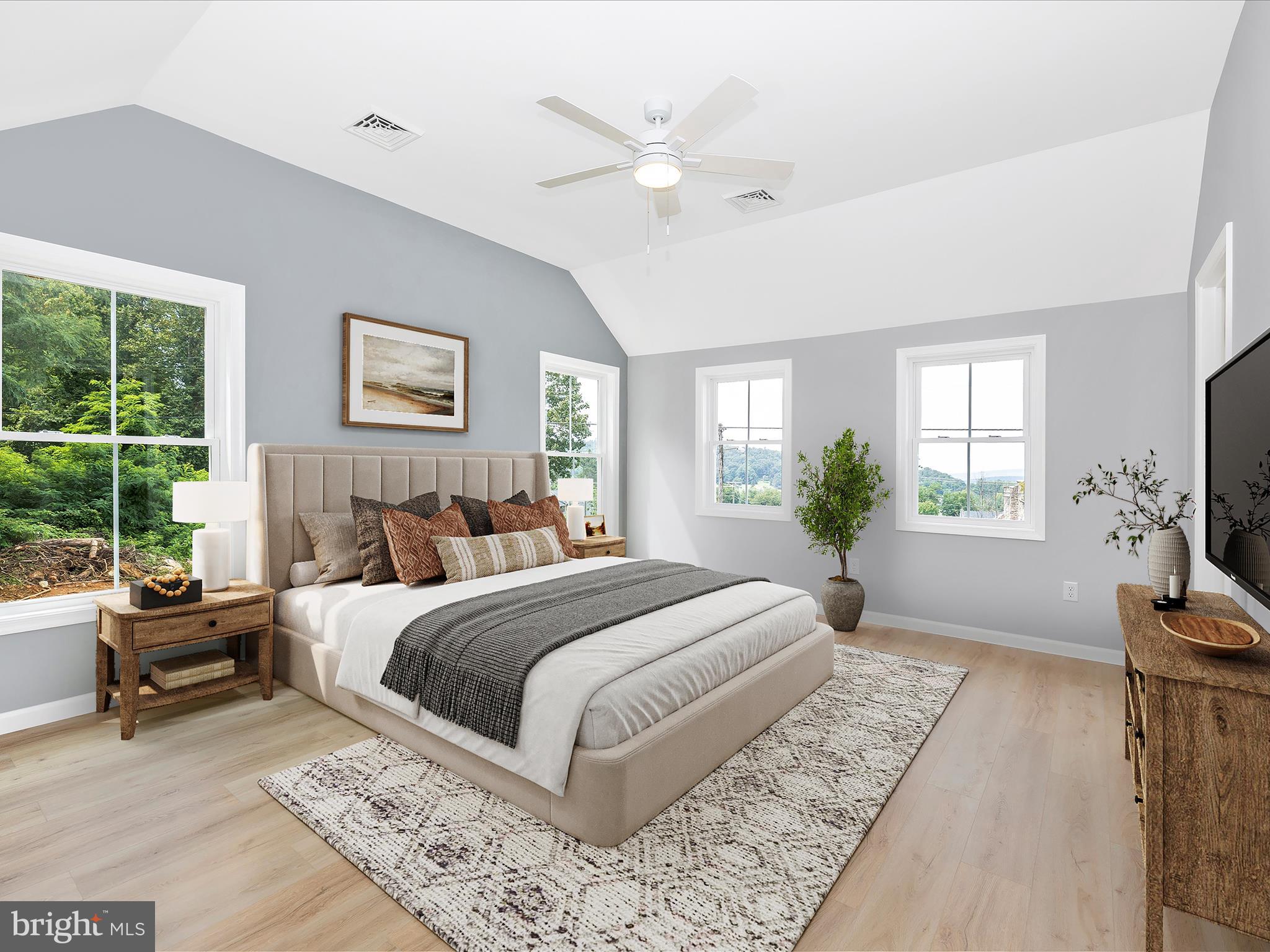 14241 Ritchie Road Cascade, MD 21719 - Photo 26 of 67 a spacious bedroom with a large bed and a window