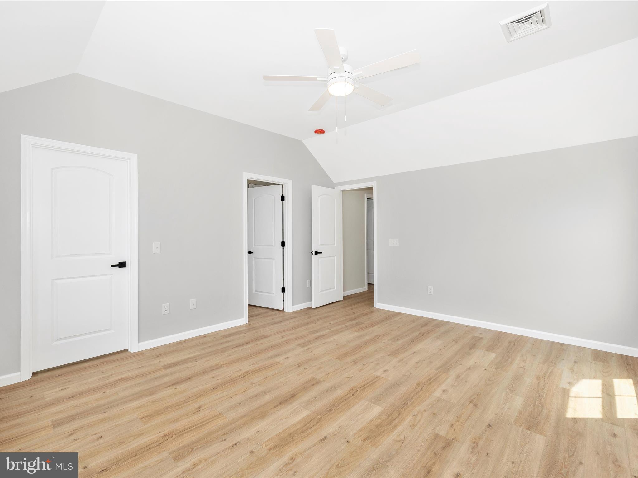 14241 Ritchie Road Cascade, MD 21719 - Photo 29 of 67 a view of an empty room with wooden floor