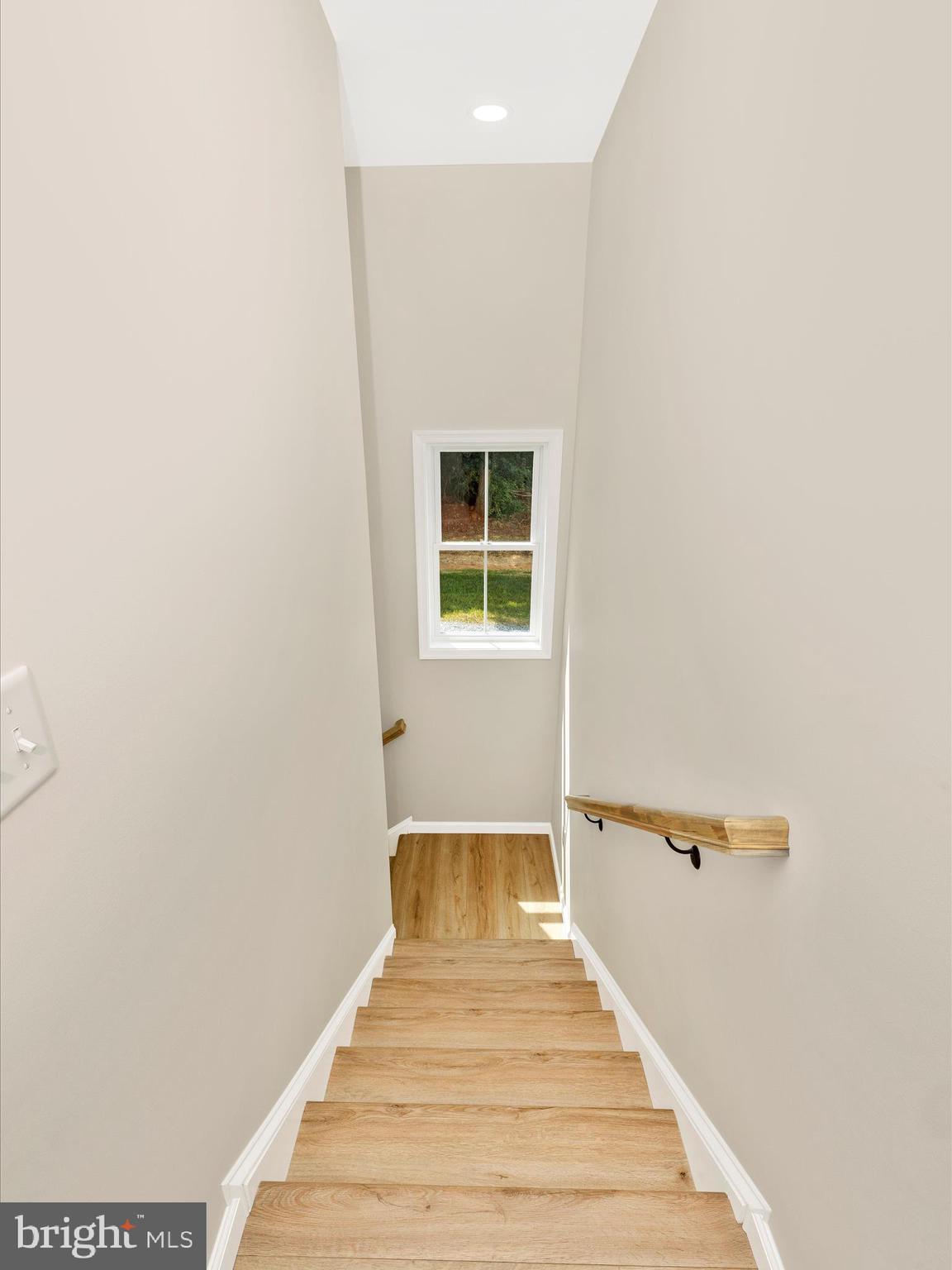 14241 Ritchie Road Cascade, MD 21719 - Photo 44 of 67 a view of a bedroom with wooden floor and a sink