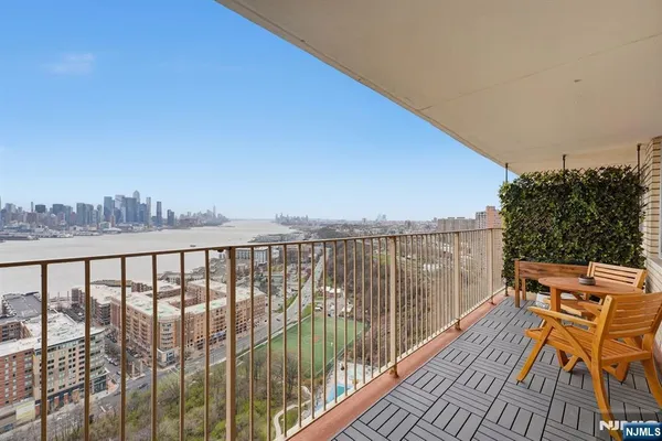 a view of balcony with furniture