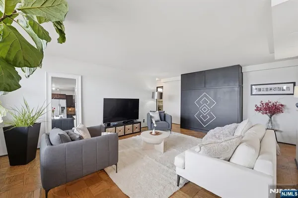 a living room with furniture and a flat screen tv