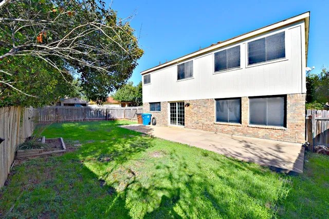 a house view with a garden space