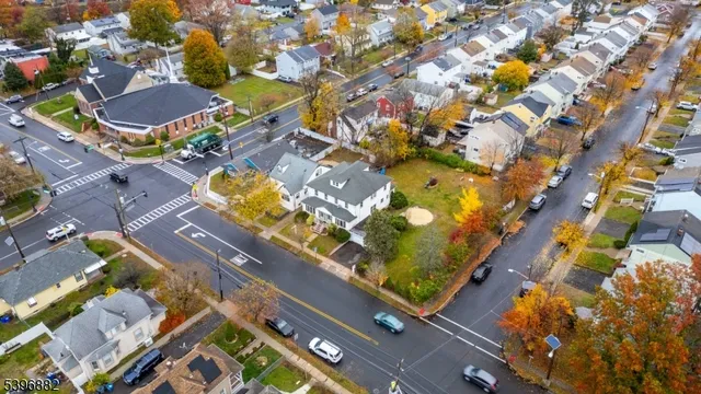 an aerial view of a residential apartment building with a yard