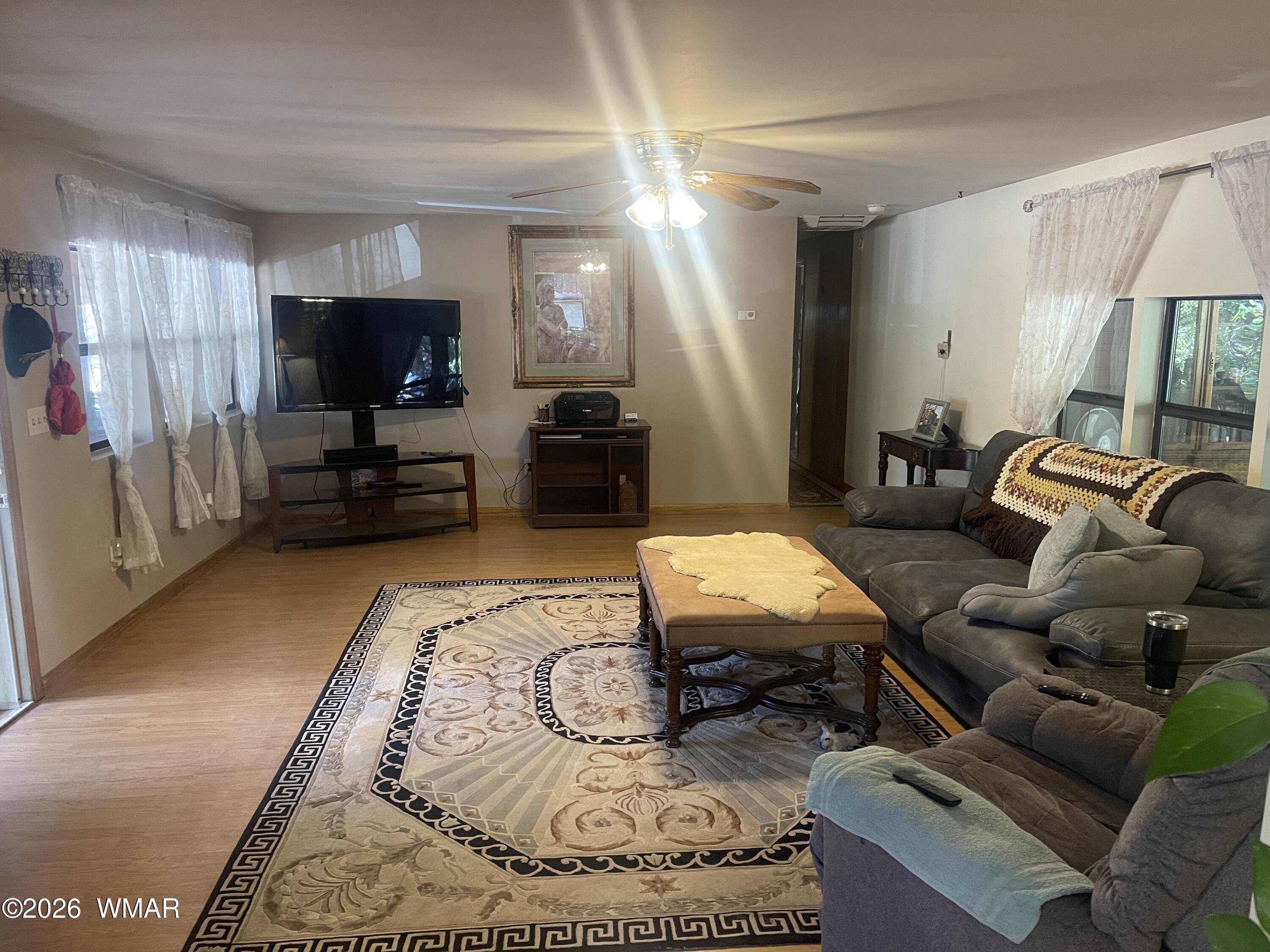 2871 Moose Trail Overgaard, AZ 85933 - Photo 3 of 25 a living room with furniture and a flat screen tv