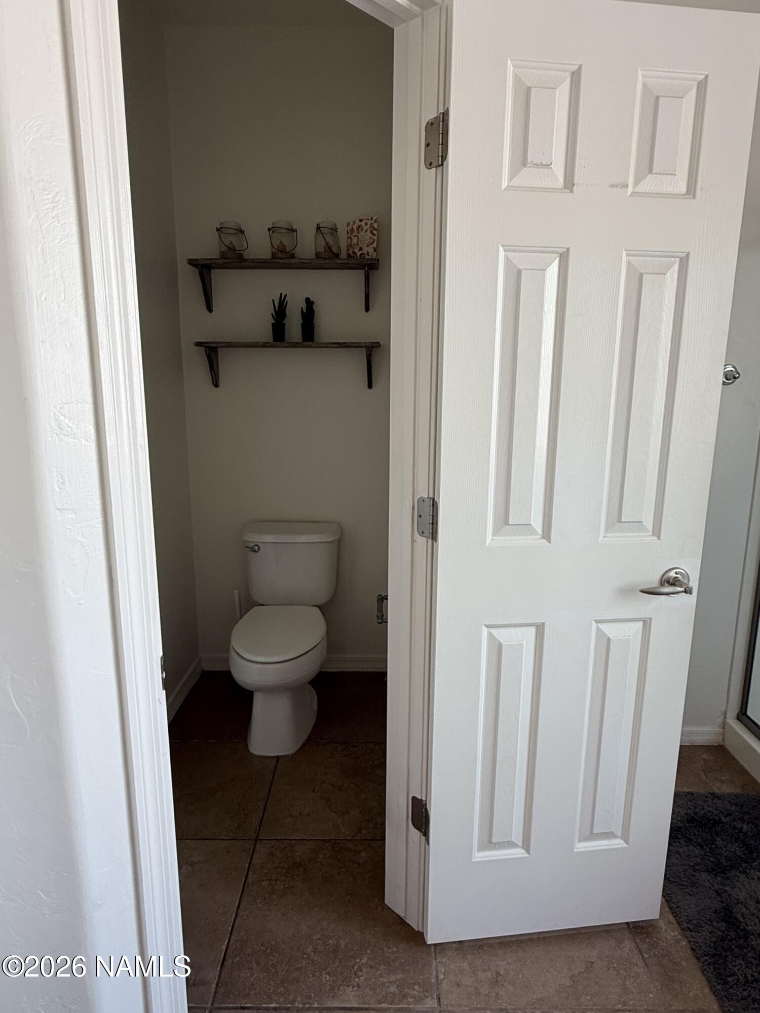 9587 South Via Bandera Vail, AZ 85641 - Photo 14 of 28 a bathroom with a toilet and a sink