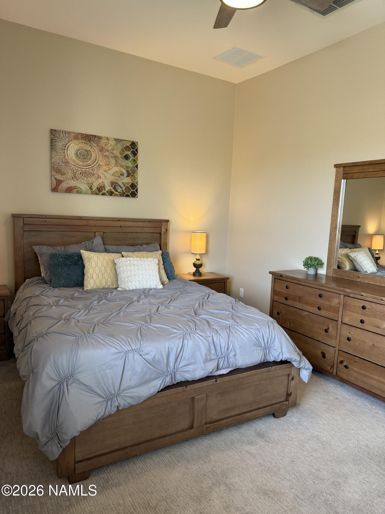 9587 South Via Bandera Vail, AZ 85641 - Photo 15 of 28 a bedroom with a bed and painting on the wall