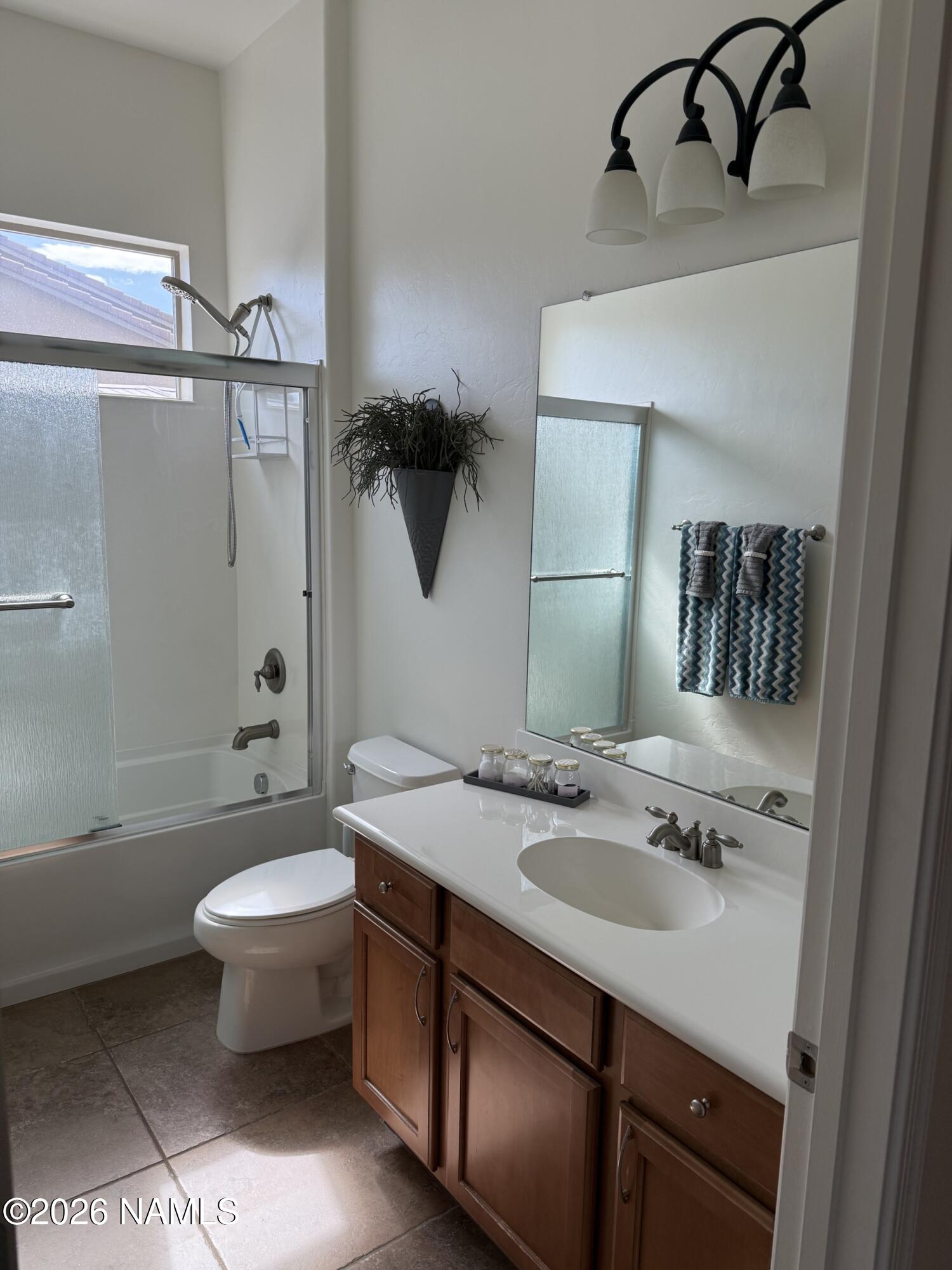 9587 South Via Bandera Vail, AZ 85641 - Photo 19 of 28 a bathroom with a sink a toilet and shower