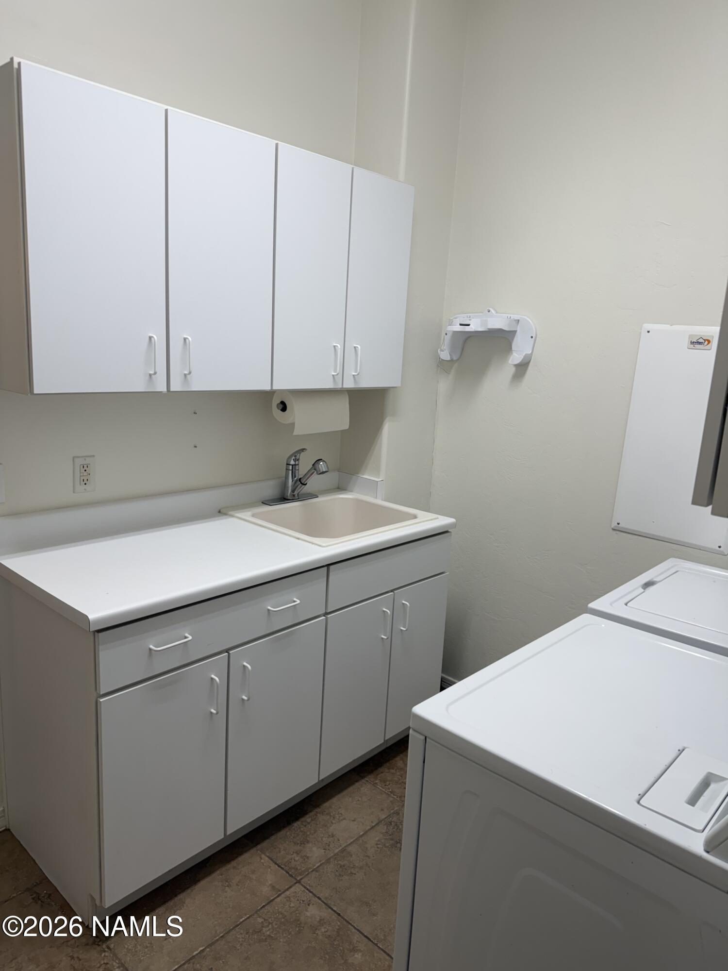 9587 South Via Bandera Vail, AZ 85641 - Photo 20 of 28 a utility room with cabinets