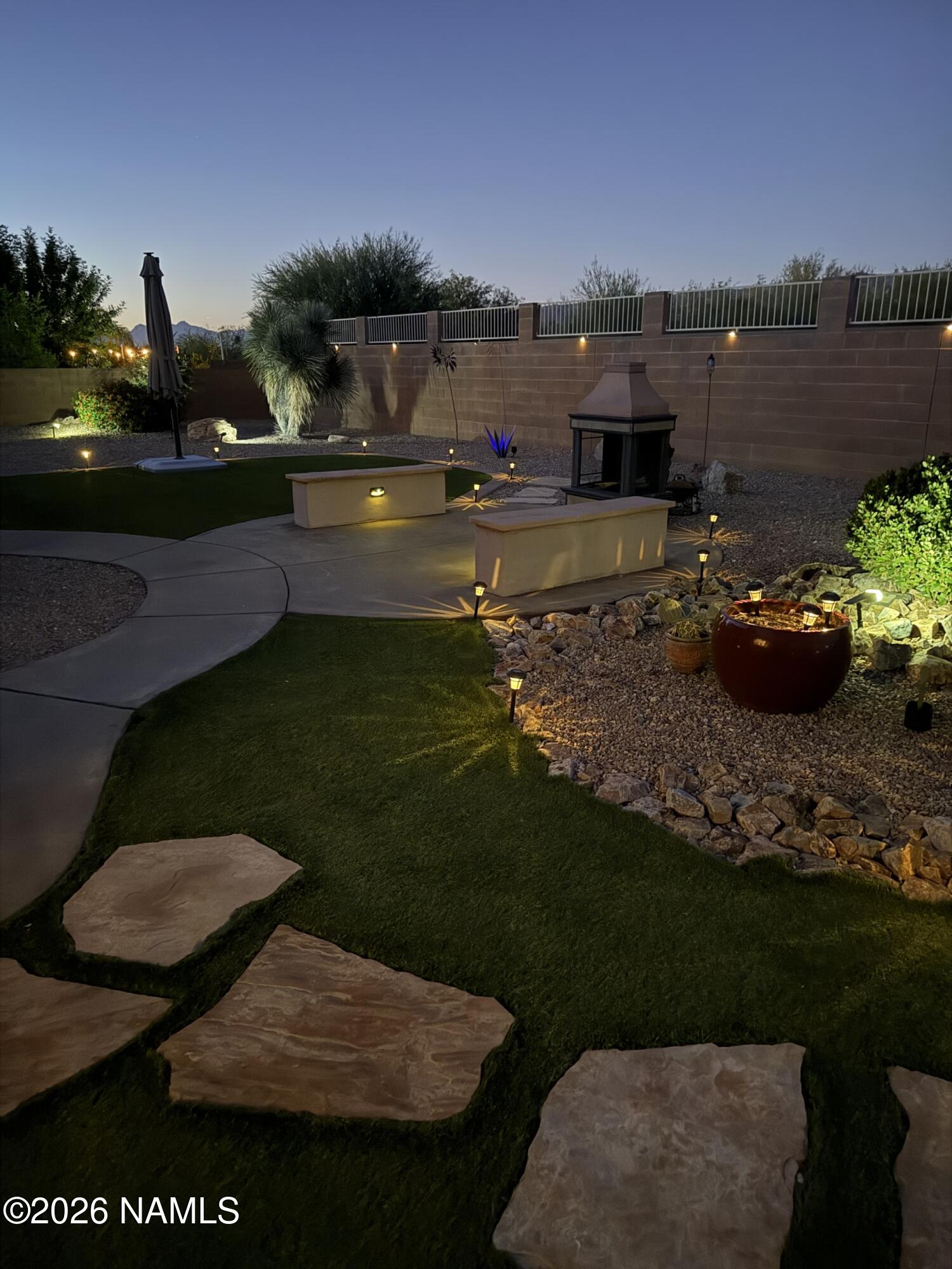9587 South Via Bandera Vail, AZ 85641 - Photo 27 of 28 a view of a backyard with seating area and lake view