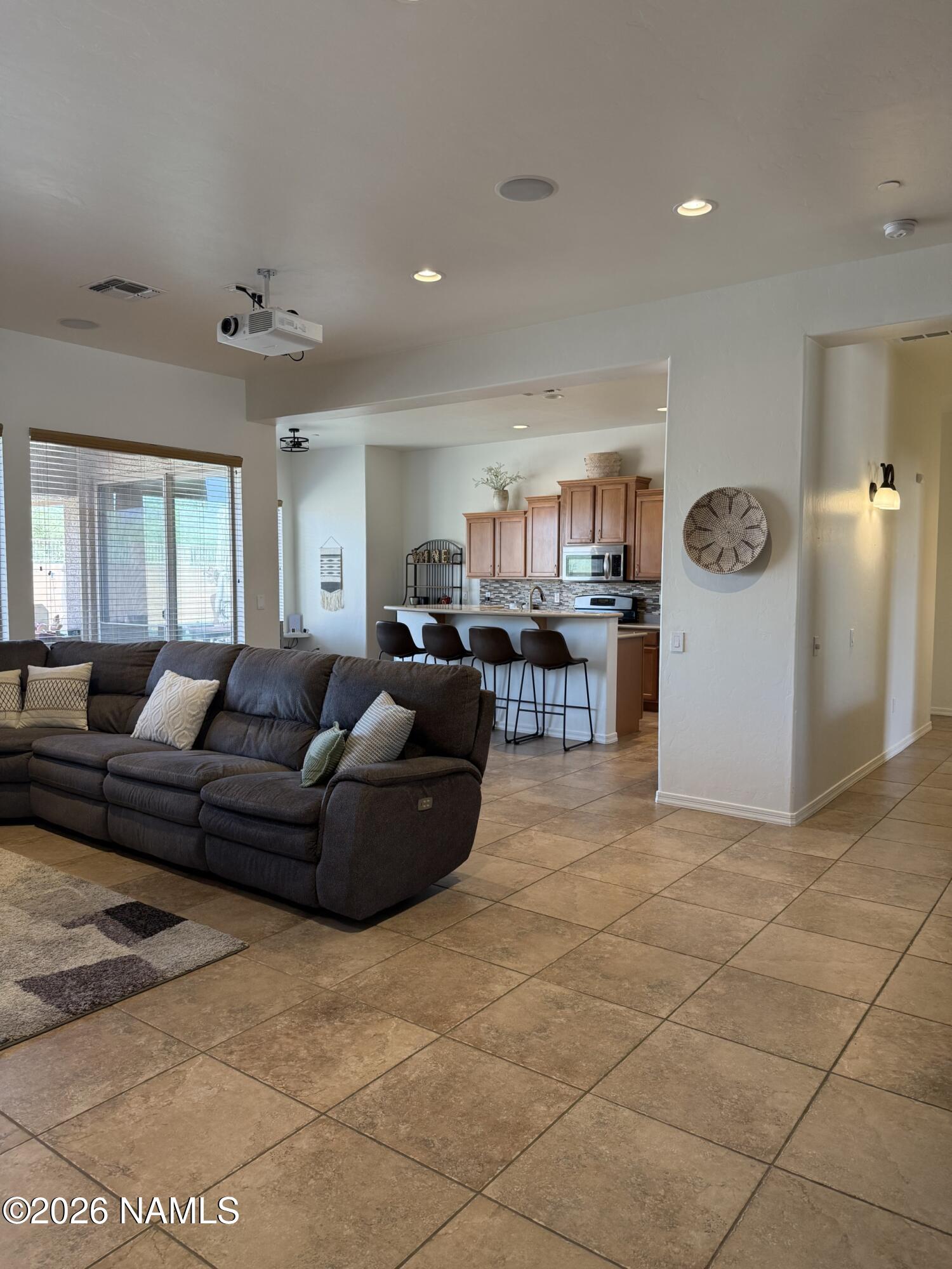 9587 South Via Bandera Vail, AZ 85641 - Photo 3 of 28 a living room with furniture and kitchen view