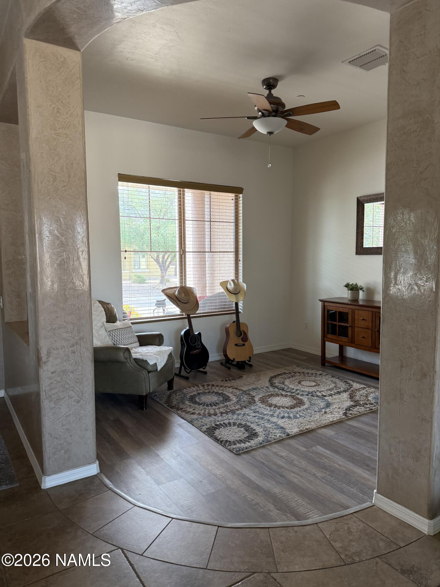 9587 South Via Bandera Vail, AZ 85641 - Photo 7 of 28 a living room with furniture and a chandelier