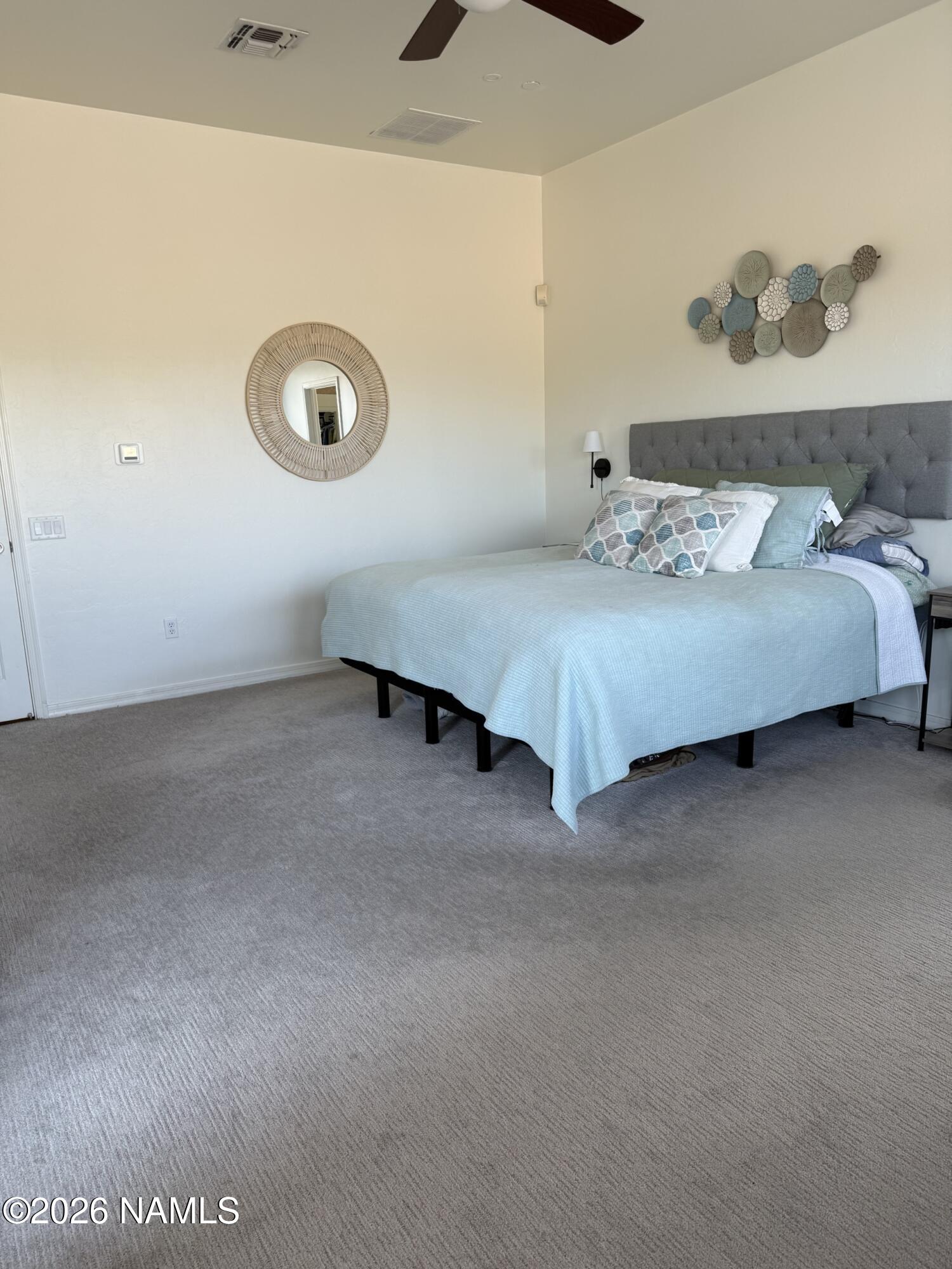 9587 South Via Bandera Vail, AZ 85641 - Photo 10 of 28 a bedroom with a bed and wall painting