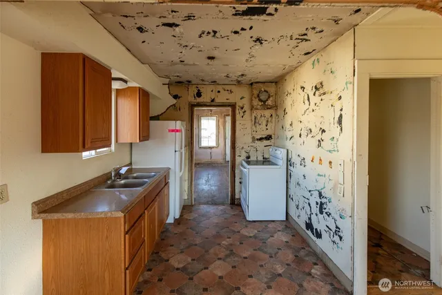 a view of an empty room and a window