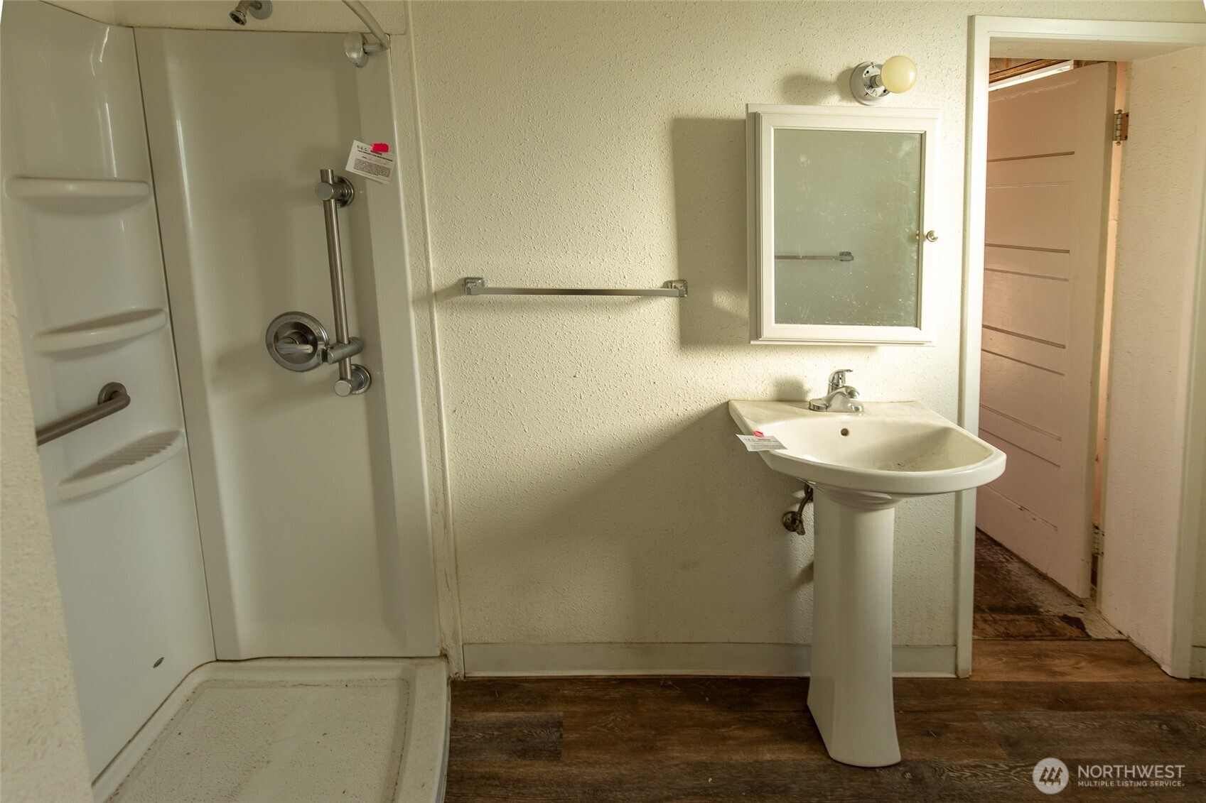722 Jackson Street Omak, WA 98841 - Photo 8 of 11 a bathroom with a sink shower and mirror