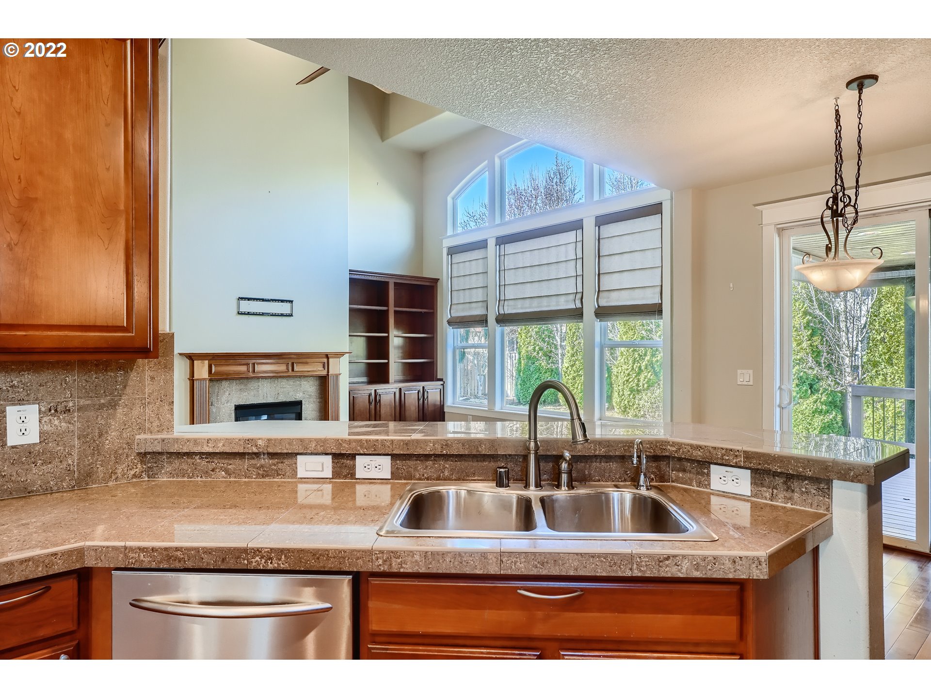 1652 South 15th Way Ridgefield, WA 98642 - Photo 11 of 32 a kitchen with granite countertop a sink and a window