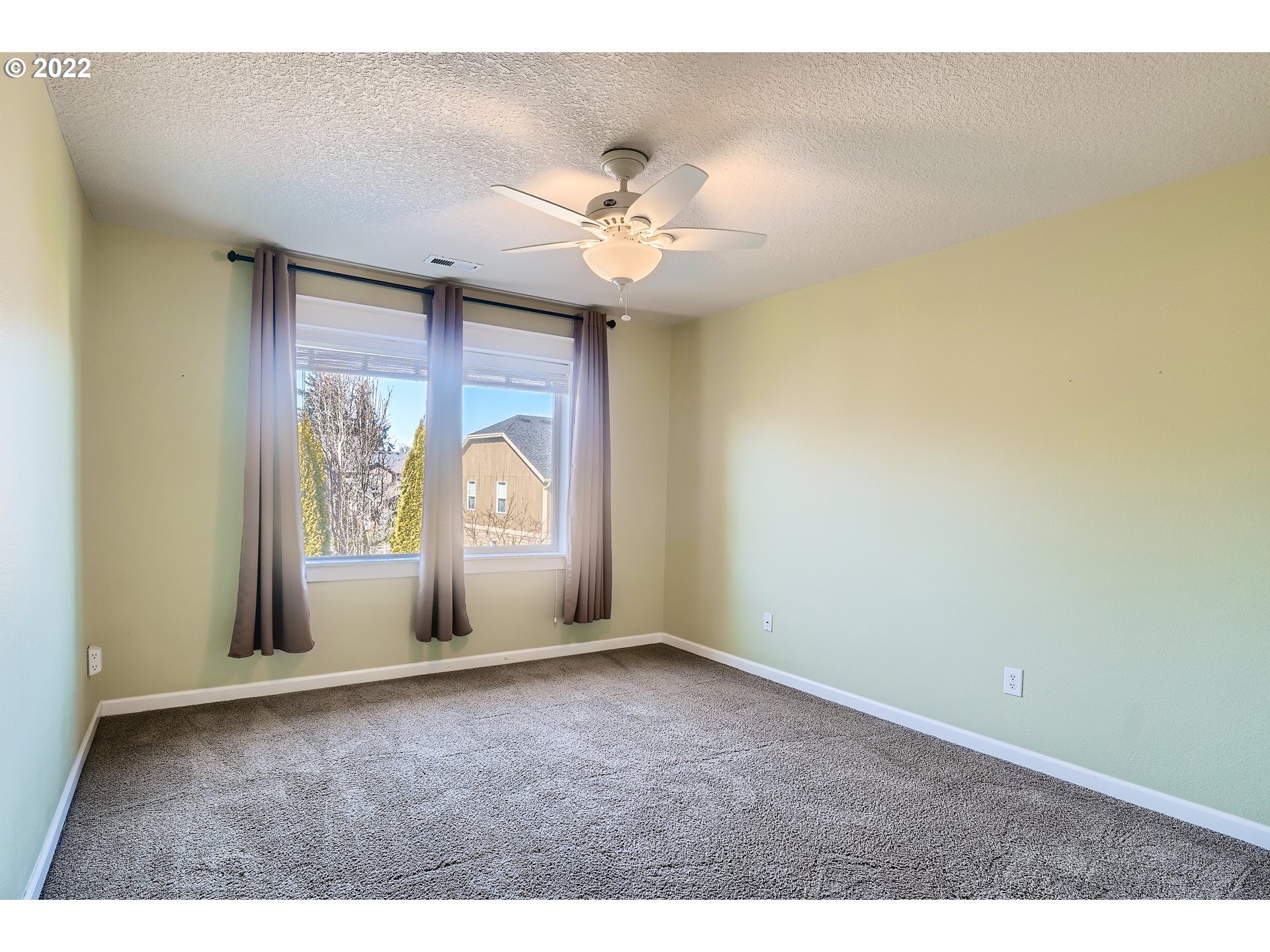 1652 South 15th Way Ridgefield, WA 98642 - Photo 25 of 32 an empty room with windows and fan