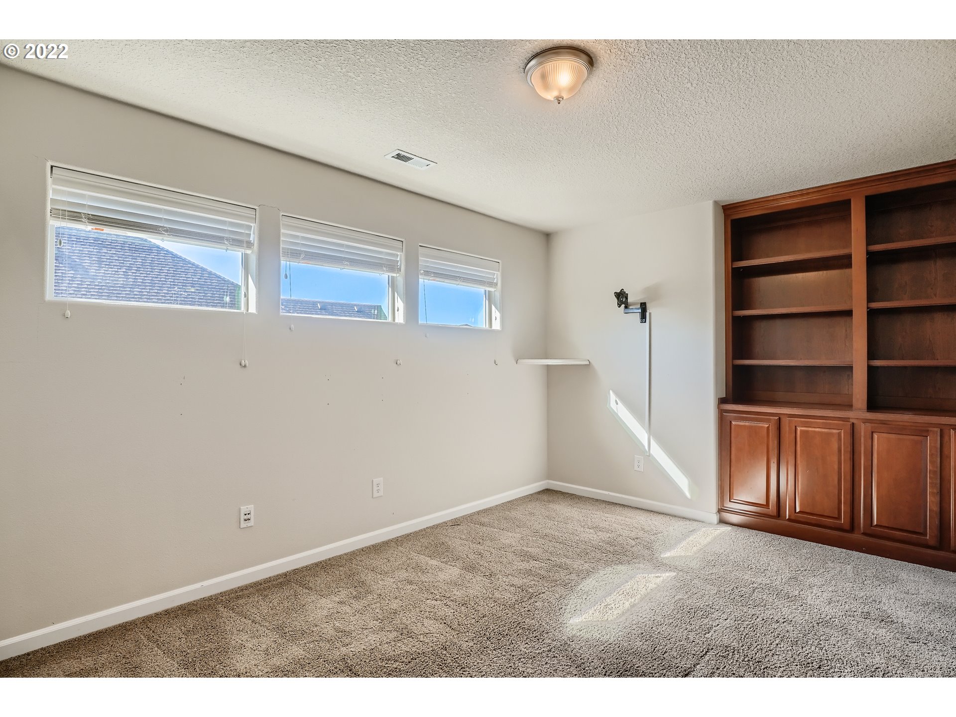 1652 South 15th Way Ridgefield, WA 98642 - Photo 28 of 32 a view of an empty room with wooden floor and closet