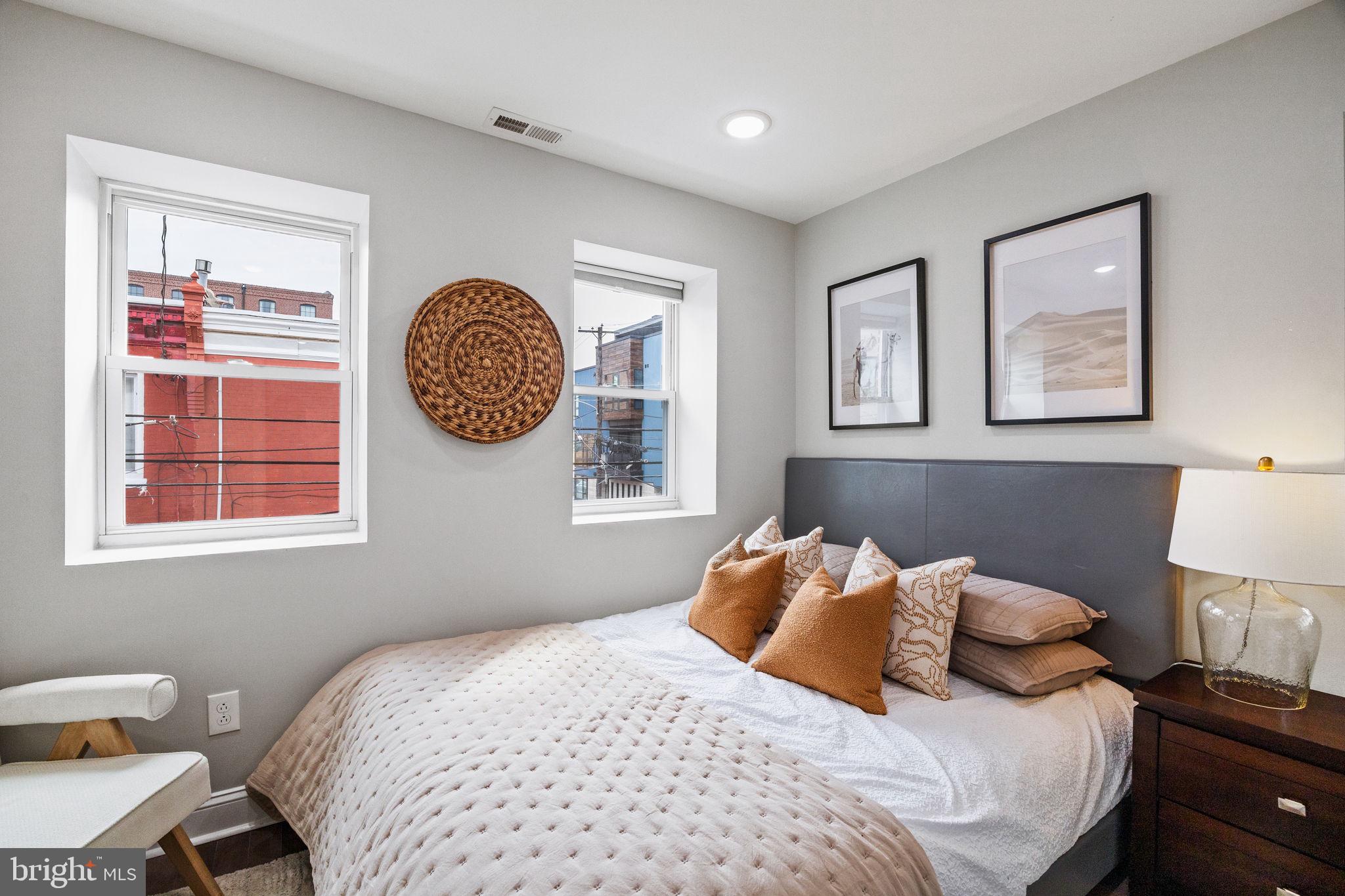 1800 Waterloo Street Philadelphia, PA 19122 - Photo 17 of 47 a bedroom with a bed and a lamp