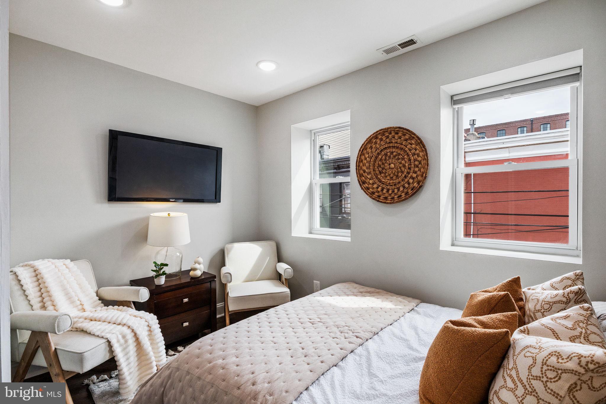 1800 Waterloo Street Philadelphia, PA 19122 - Photo 19 of 47 a bedroom with a bed and a tv