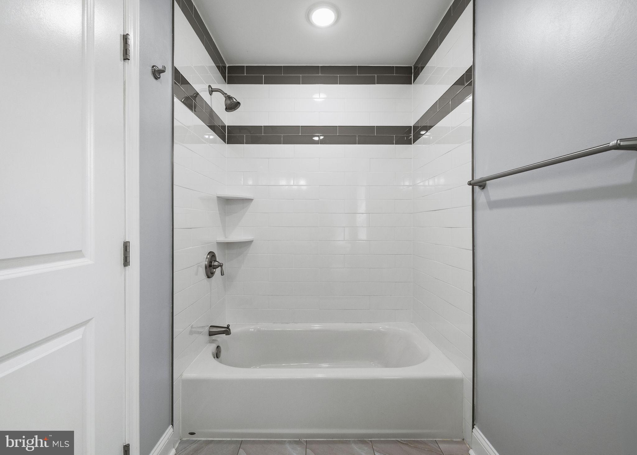 1800 Waterloo Street Philadelphia, PA 19122 - Photo 23 of 47 a bathroom with a bathtub and a shower