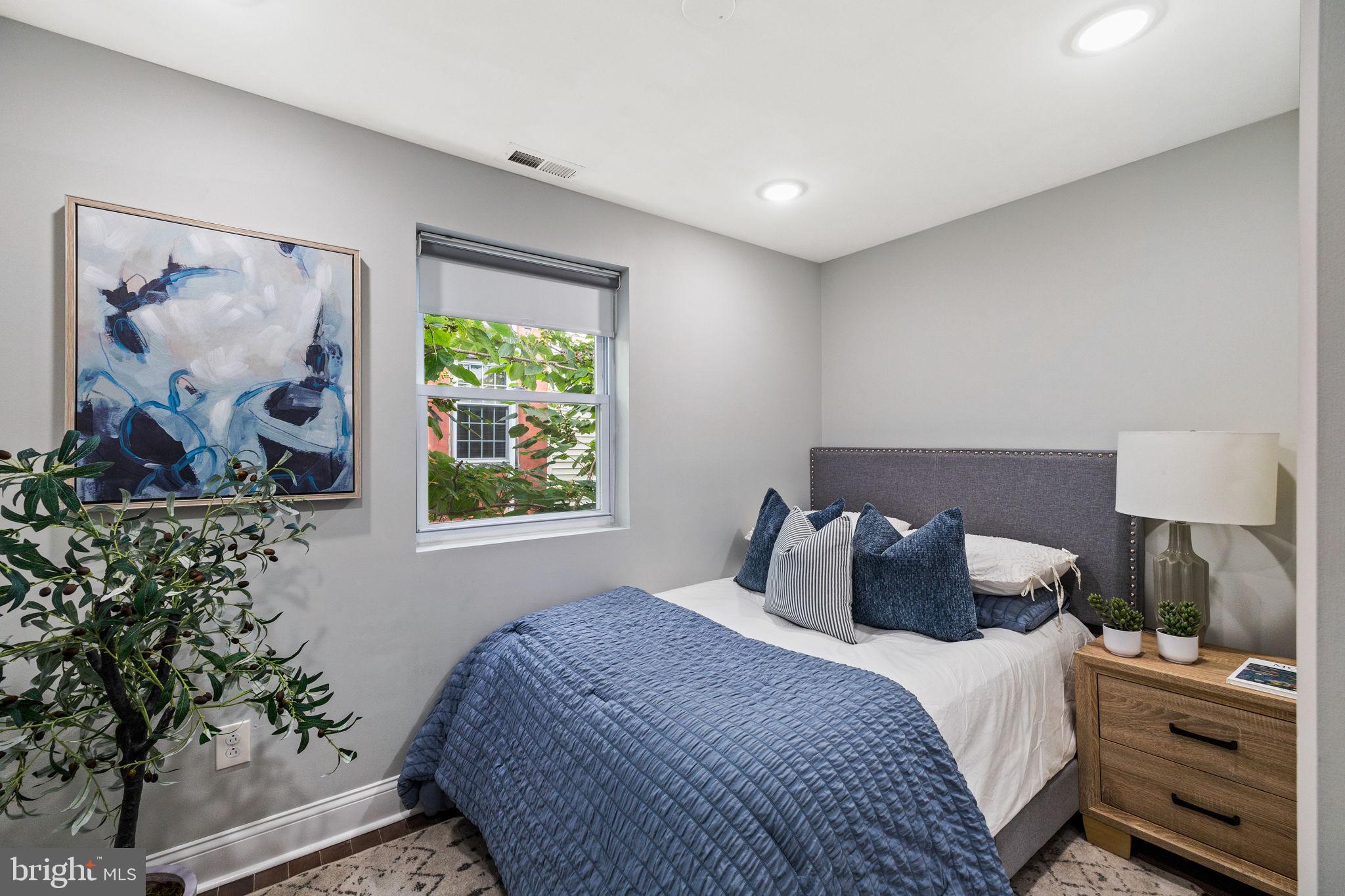 1800 Waterloo Street Philadelphia, PA 19122 - Photo 25 of 47 a bedroom with a bed and a window