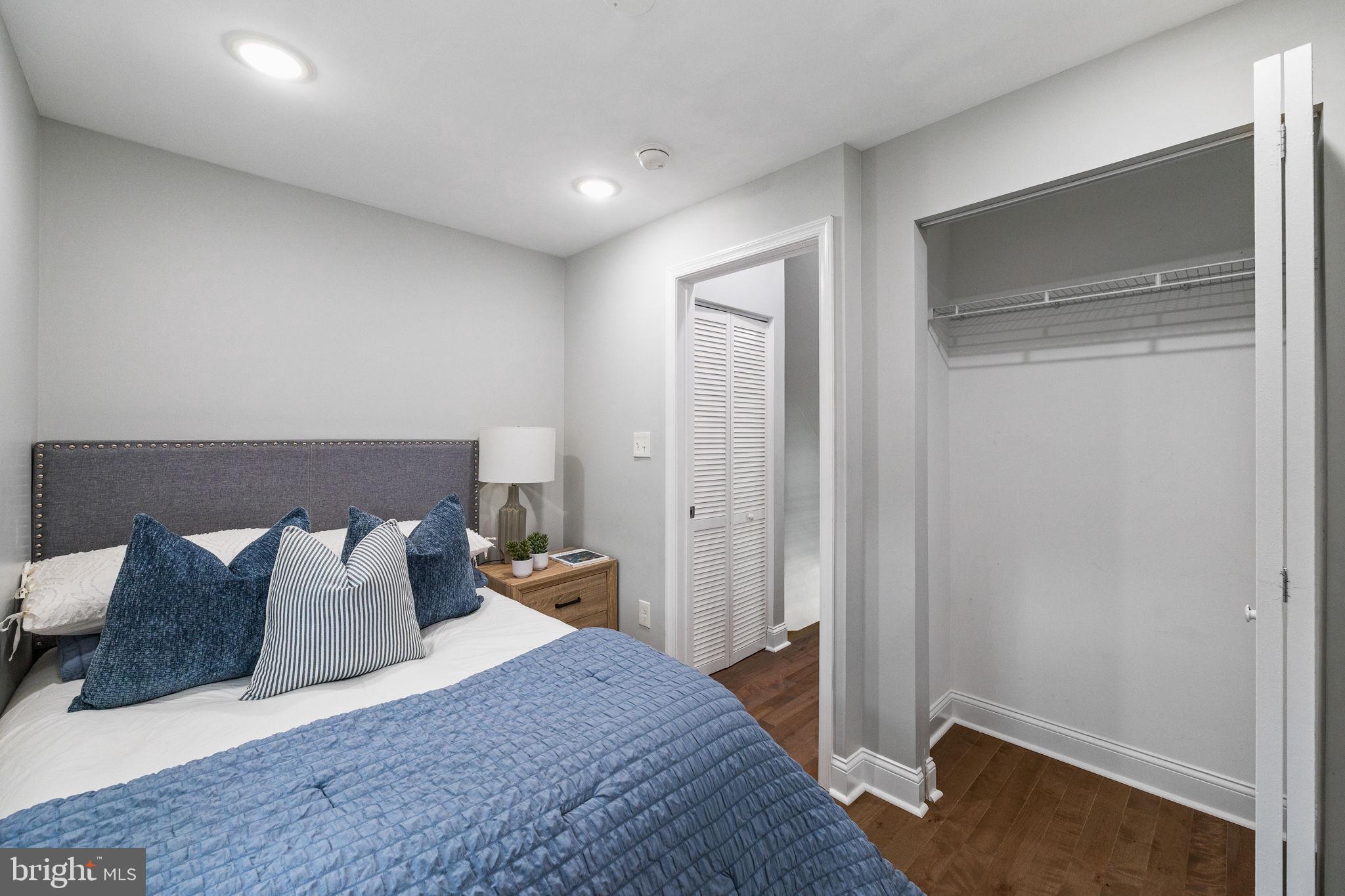 1800 Waterloo Street Philadelphia, PA 19122 - Photo 28 of 47 a bedroom with a bed and a night stand