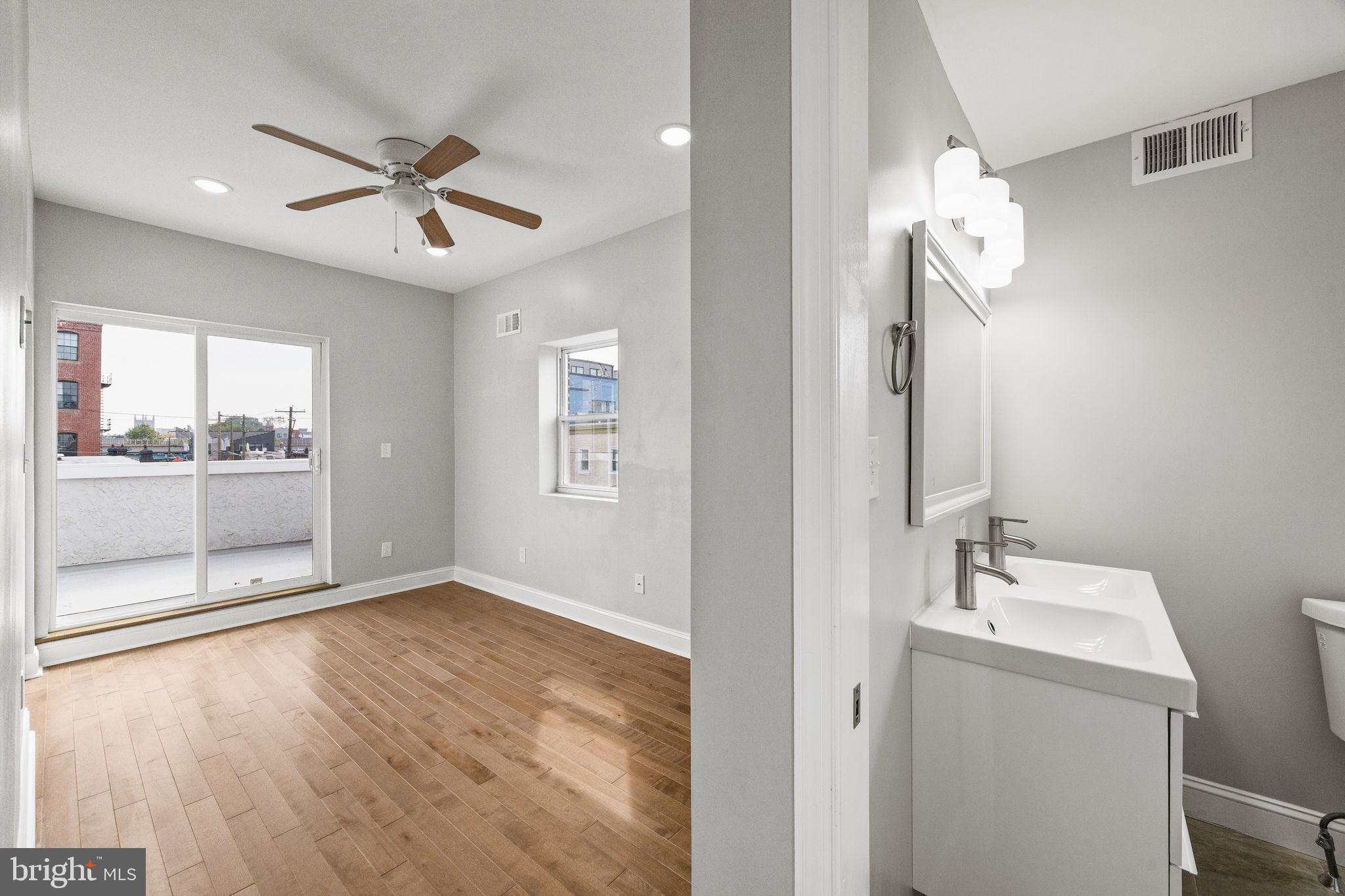 1800 Waterloo Street Philadelphia, PA 19122 - Photo 30 of 47 a view of a room with a mirror and fan