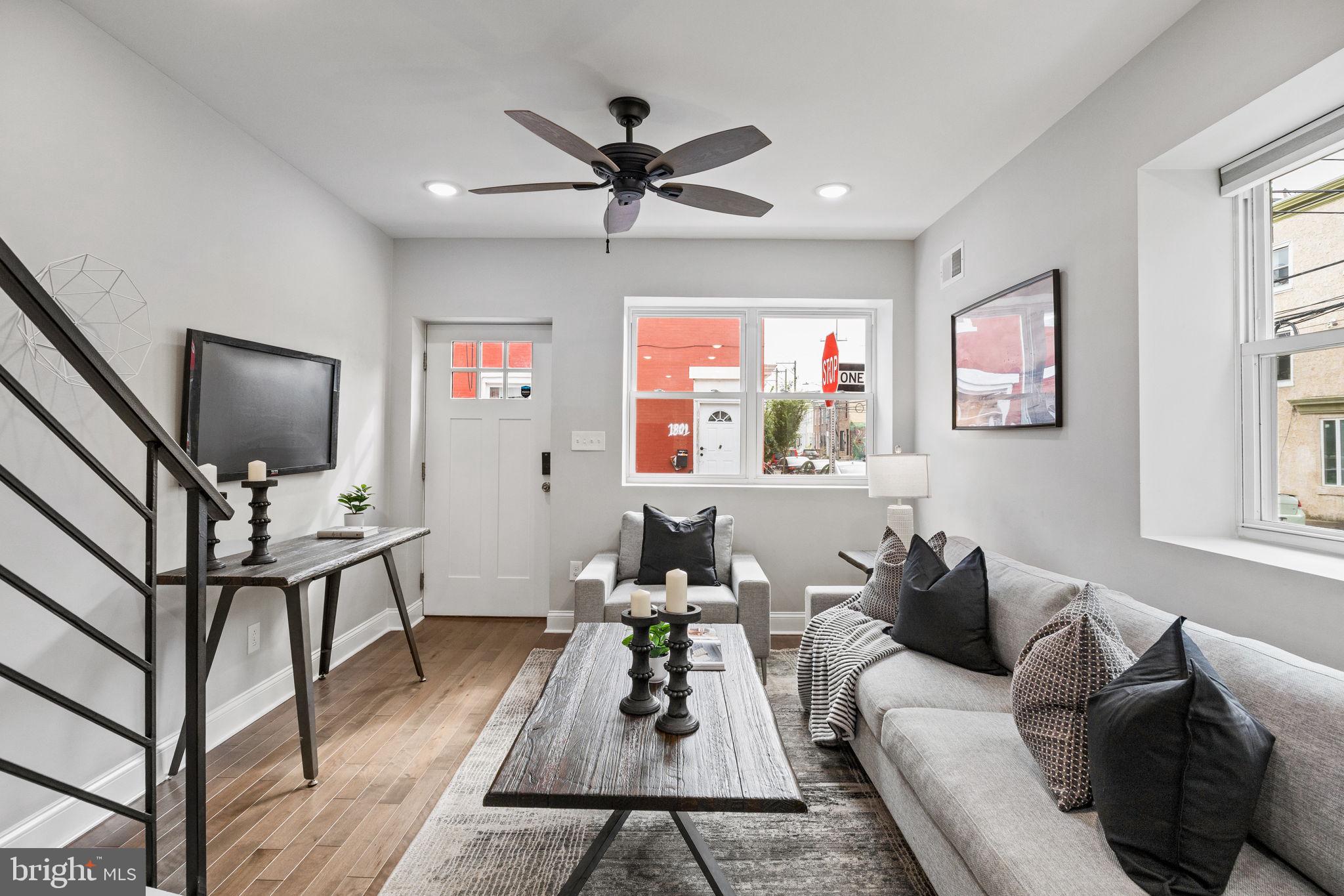 1800 Waterloo Street Philadelphia, PA 19122 - Photo 3 of 47 a living room with furniture and a flat screen tv