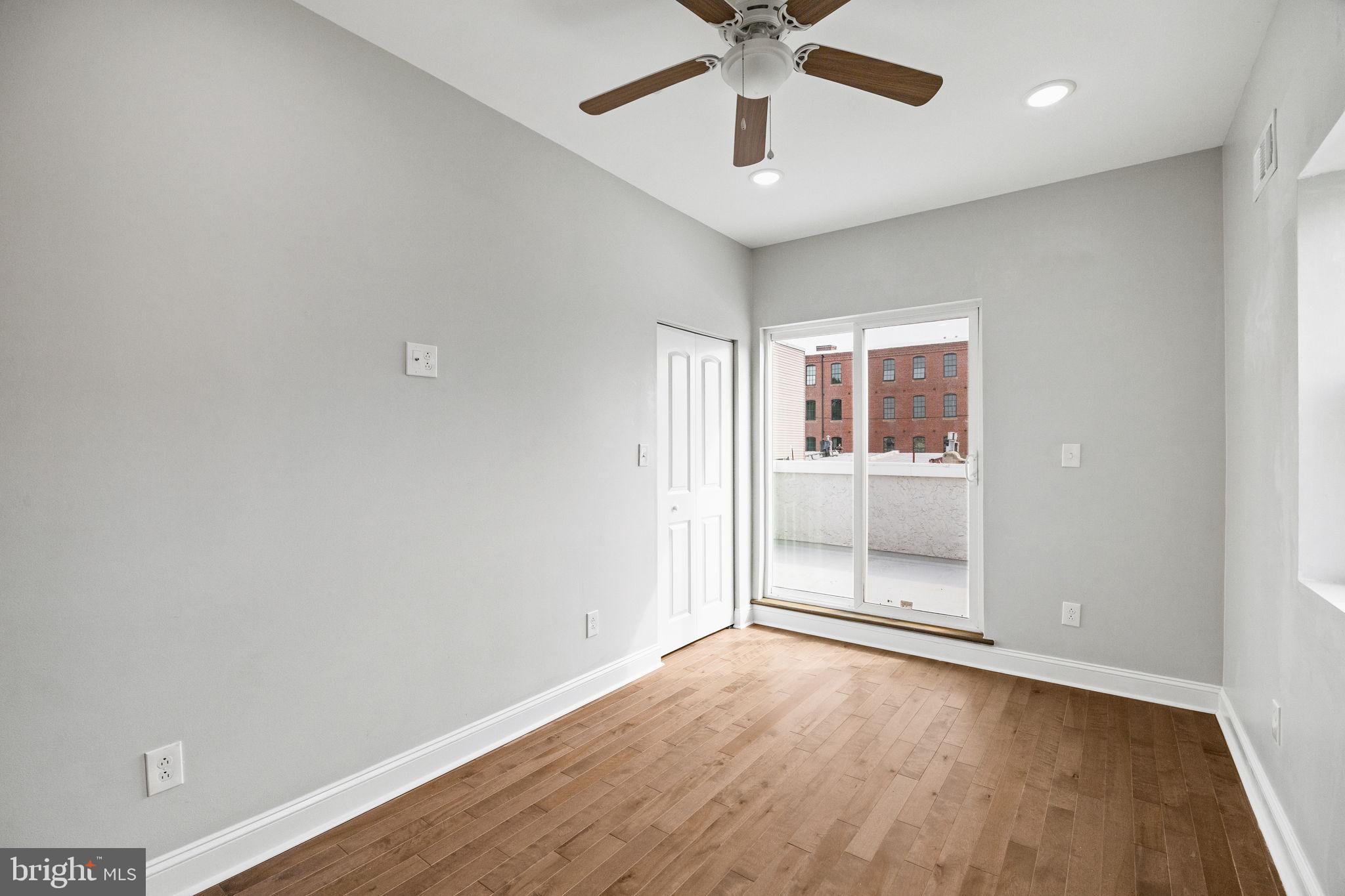 1800 Waterloo Street Philadelphia, PA 19122 - Photo 32 of 47 wooden floor in an empty room with a window