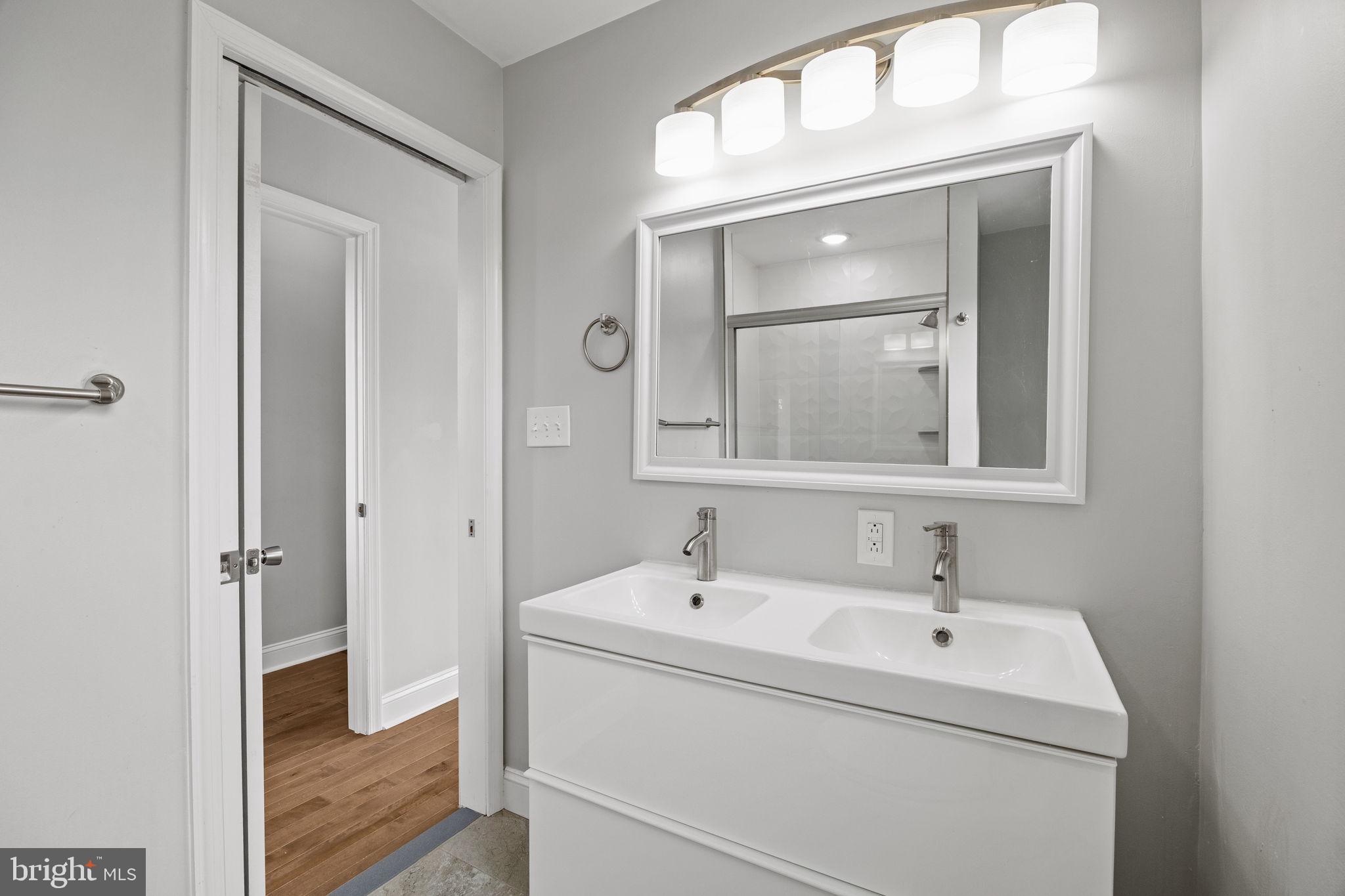 1800 Waterloo Street Philadelphia, PA 19122 - Photo 37 of 47 a bathroom with a sink and a mirror