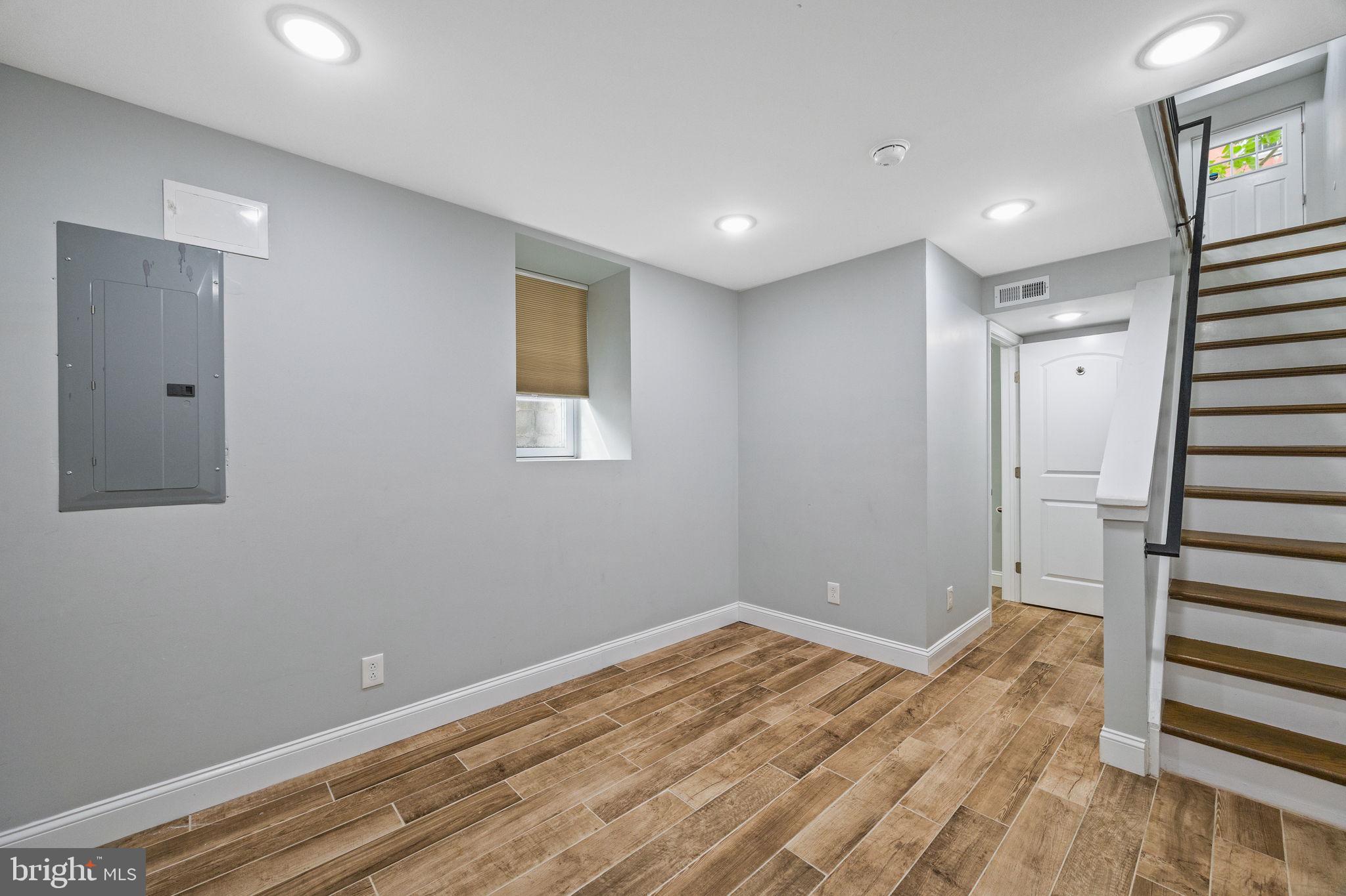 1800 Waterloo Street Philadelphia, PA 19122 - Photo 41 of 47 a view of a room with wooden floor and stairs