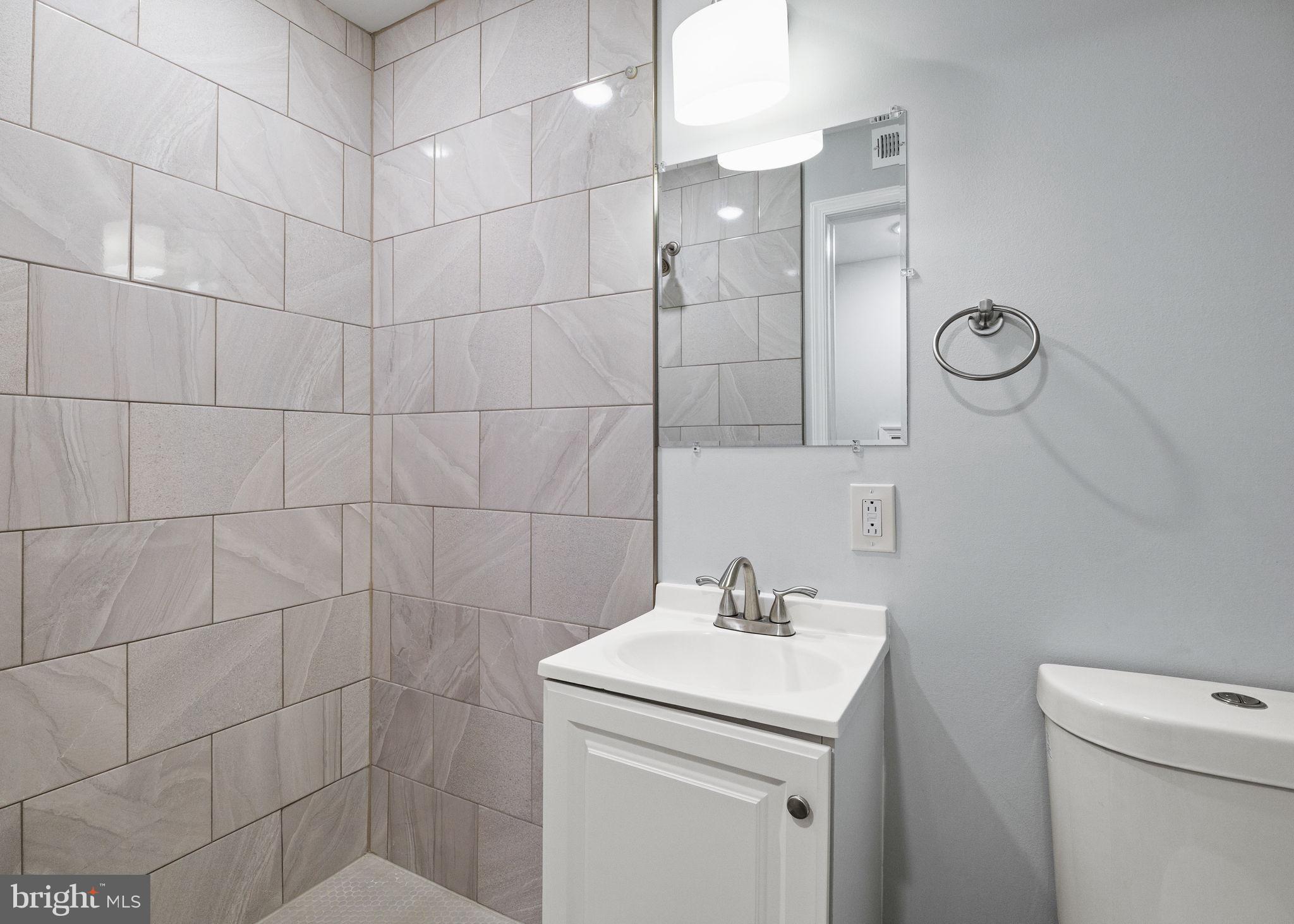 1800 Waterloo Street Philadelphia, PA 19122 - Photo 44 of 47 a bathroom with a sink toilet and shower