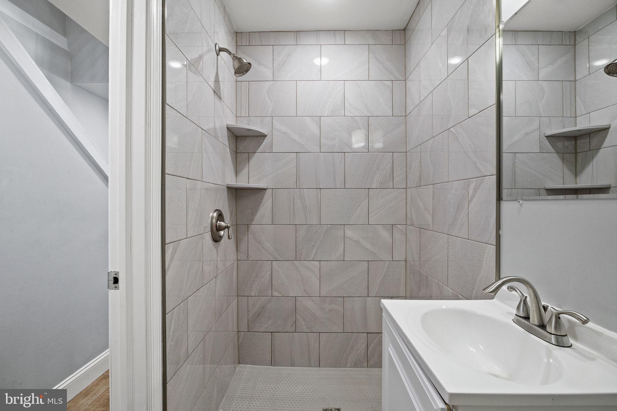 1800 Waterloo Street Philadelphia, PA 19122 - Photo 45 of 47 a bathroom with a sink shower and a mirror