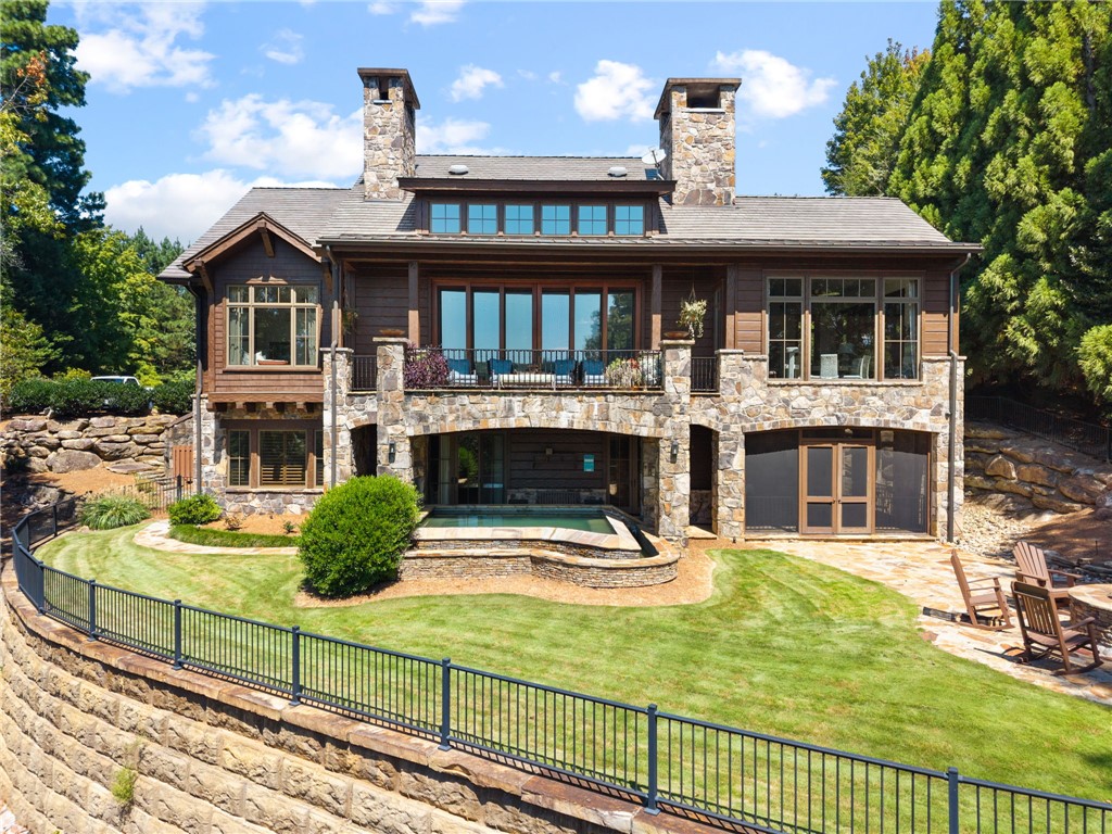 Infinity hot tub and park like manicured yard with fire pit