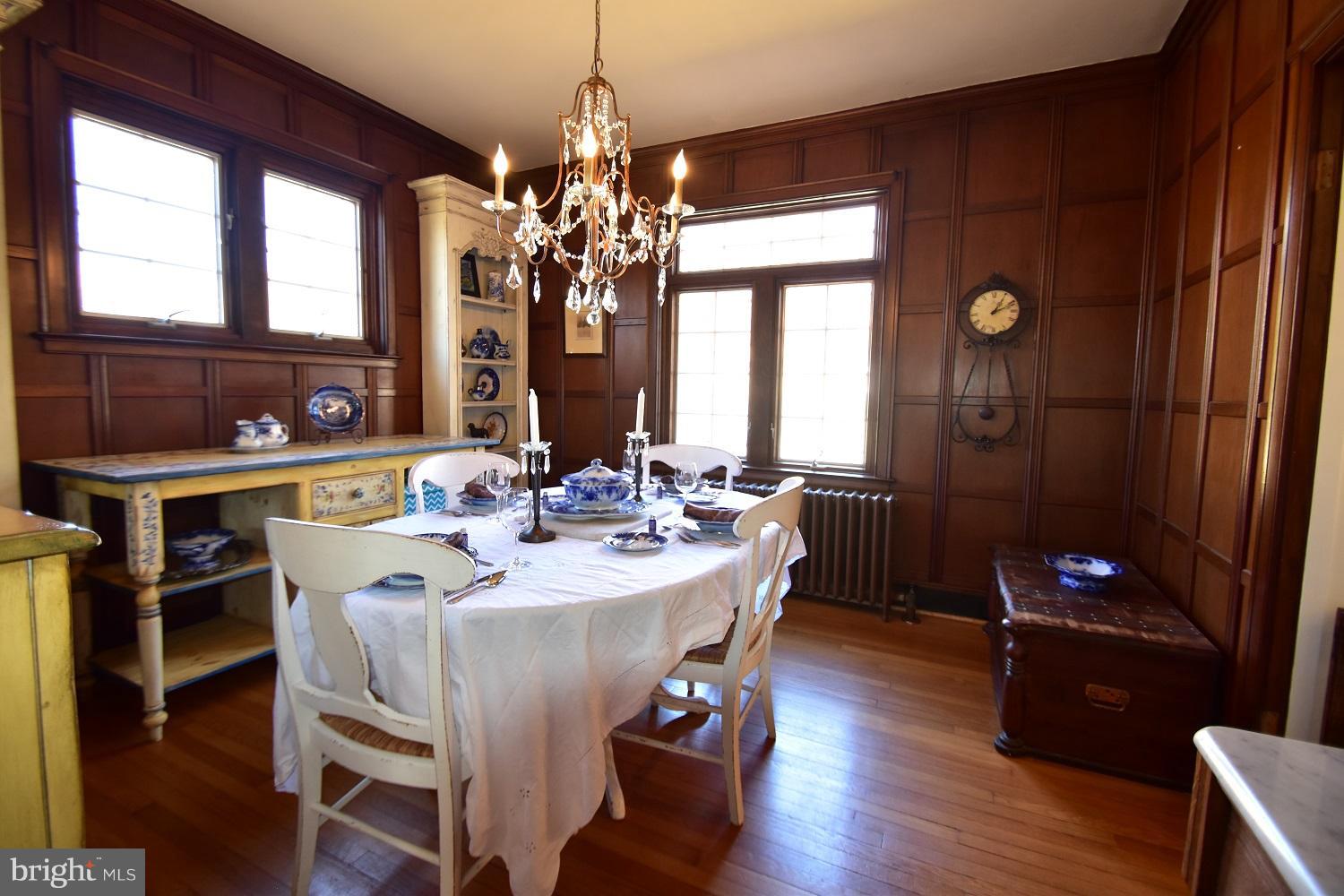 303 Rolling Rd. Baltimore, MD 21228 - Photo 11 of 21 a view of a dining room with furniture window and wooden floor