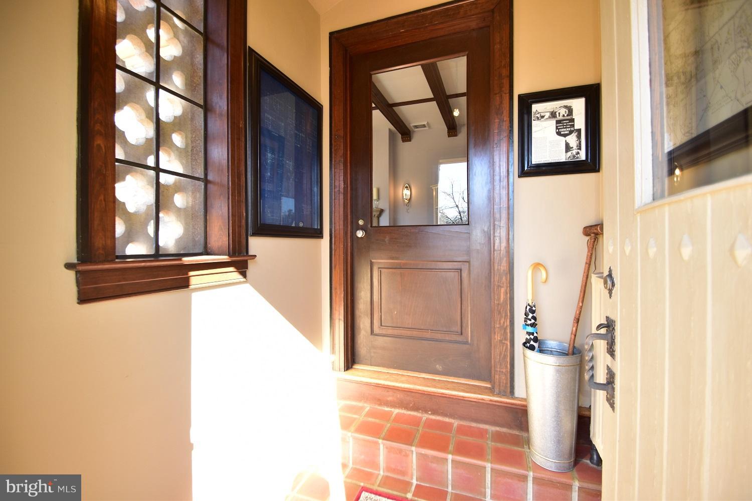 303 Rolling Rd. Baltimore, MD 21228 - Photo 7 of 21 a view of a door and wooden floor