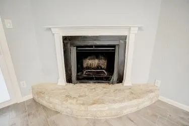 a living room with a fireplace