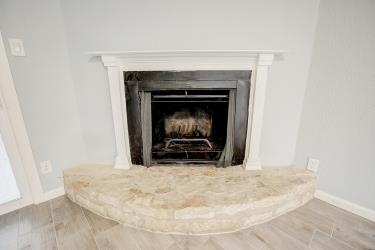 6906 Lovely Lane Austin, TX 78744 - Photo 5 of 20 a living room with a fireplace