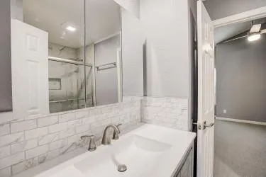 a bathroom with a sink and a mirror