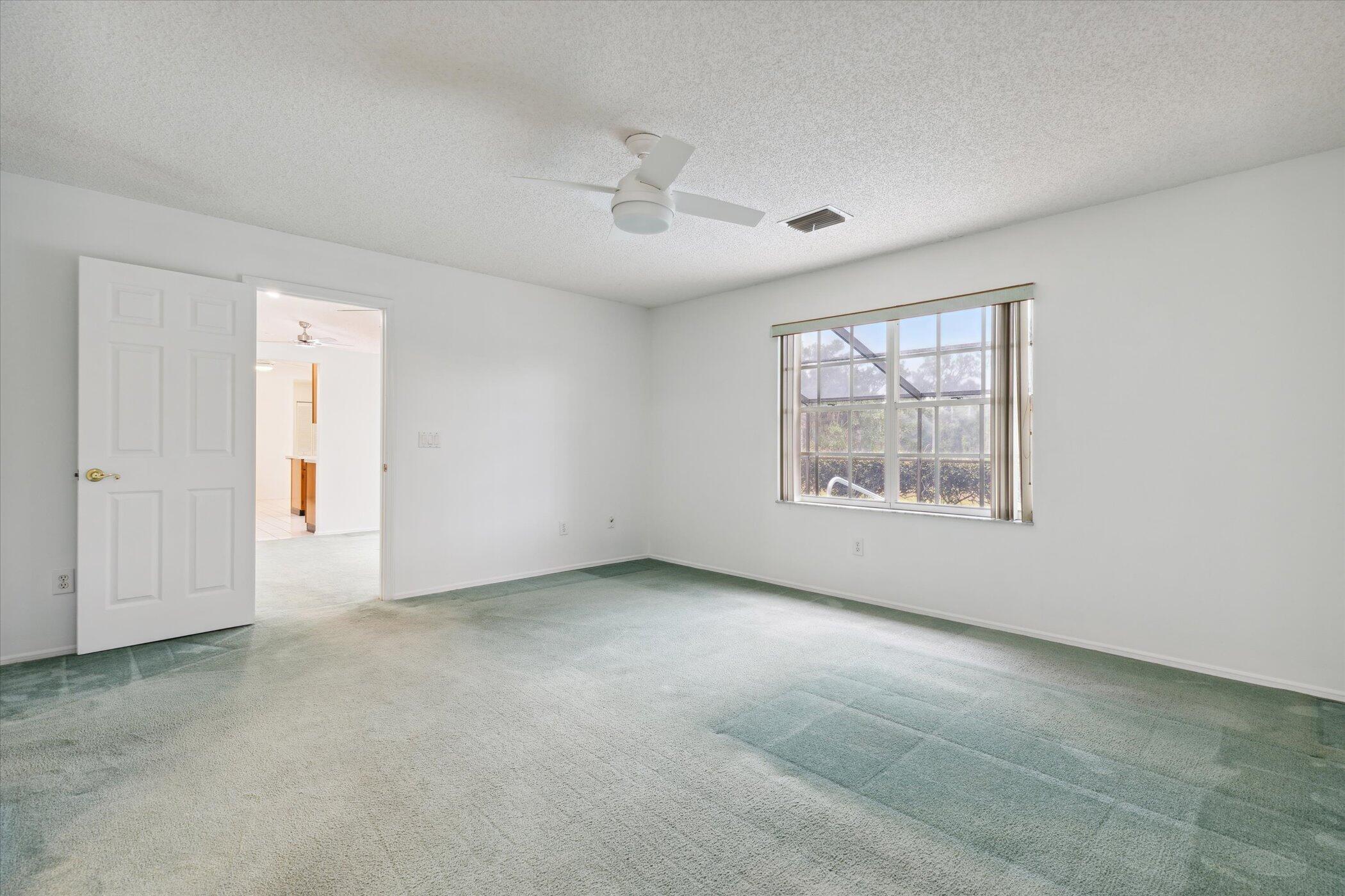 1270 Meadowbrook Road Northeast Palm Bay, FL 32905 - Photo 27 of 58 Primary Bedroom