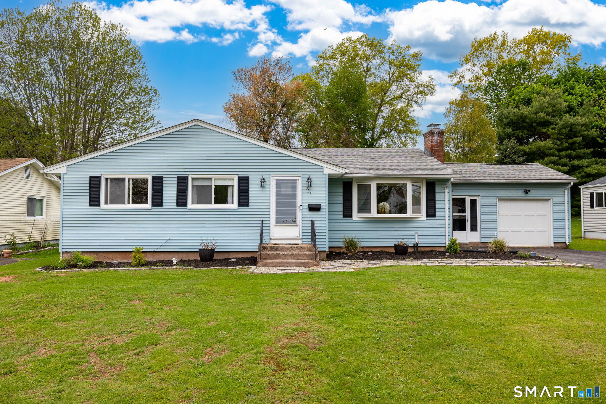 325 Barbara Road Middletown, CT 06457 - Photo 3 of 40 a front view of a house with a yard