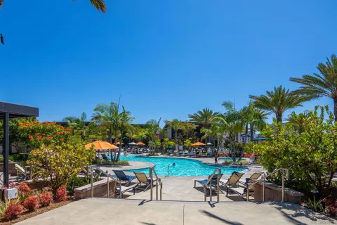 a view of a patio with table and chairs and potted plants