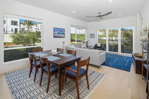 a view of a dining room with furniture window and wooden floor