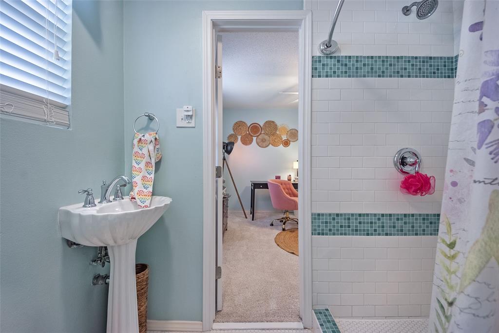 5739 Banting Way Dallas, TX 75227 - Photo 8 of 15 a bathroom with a sink and mirror